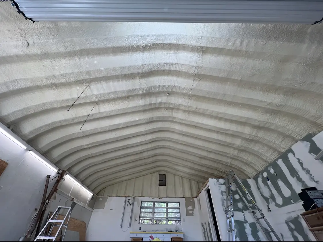 Spray polyurethane foam applied to the underside of a metal roof deck in Ashburn